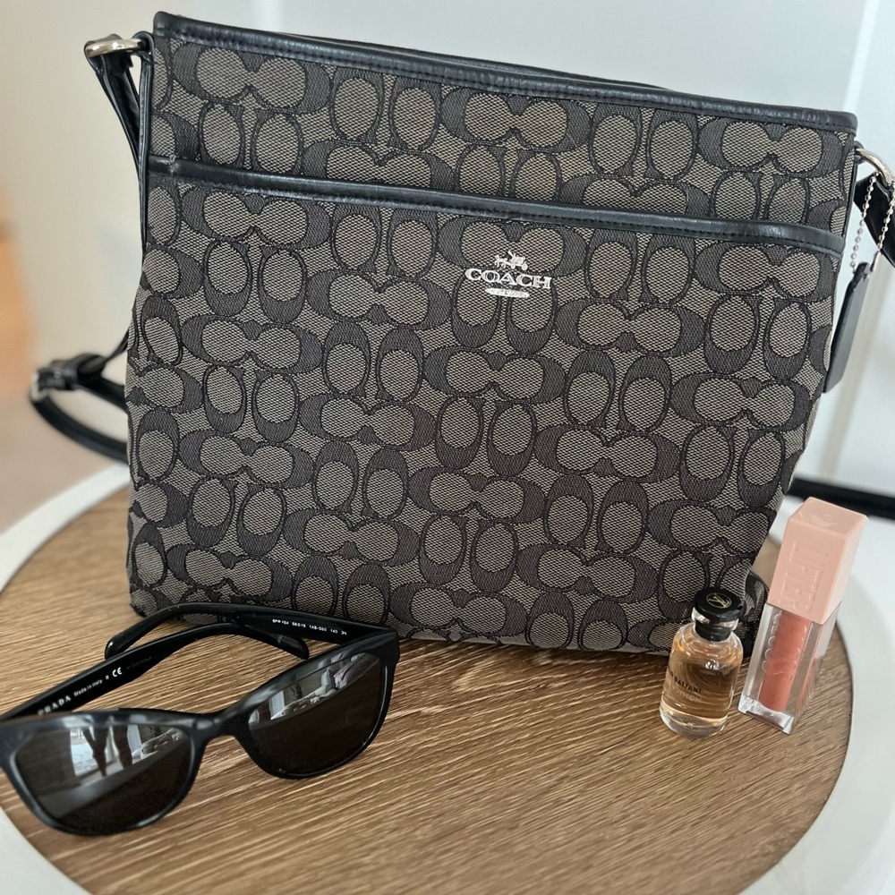 Medium size black Coach shoulder or crossbody. Used